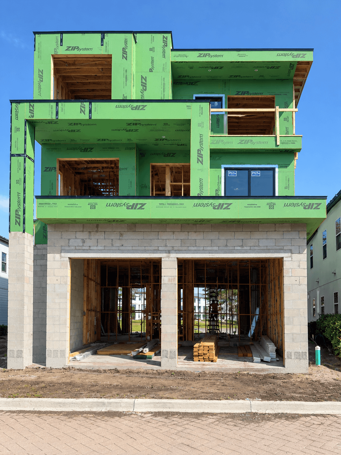 Electrical rough-in during framing of a three-story custom home in Central Florida